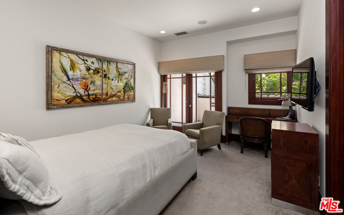 13947 Durham Road Beverly Hills, CA 90210 - Photo 30 of 46 a bedroom with a bed and a couch