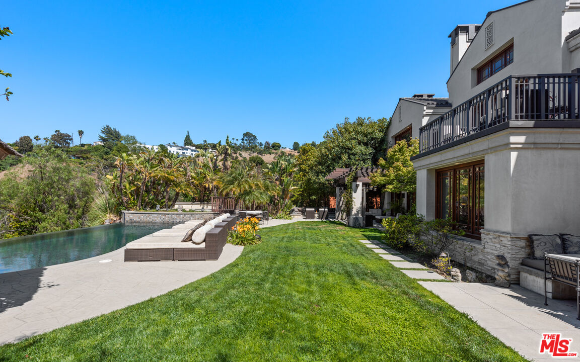 13947 Durham Road Beverly Hills, CA 90210 - Photo 42 of 46 a view of a house with a yard and sitting area