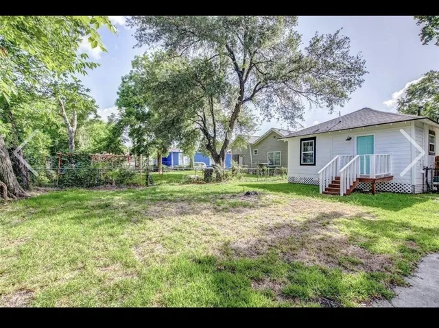 a view of outdoor space with deck and yard