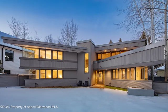 a front view of a building with a yard