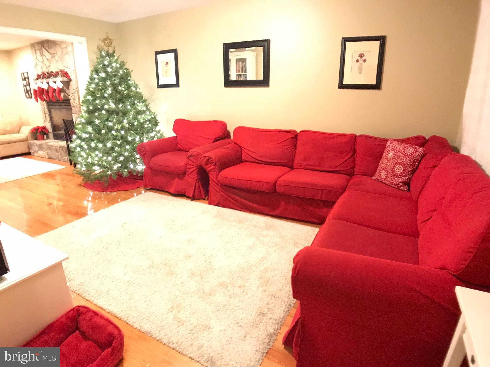 2313 Ruth Avenue Baltimore, MD 21219 - Photo 3 of 25 a living room with furniture and a bed
