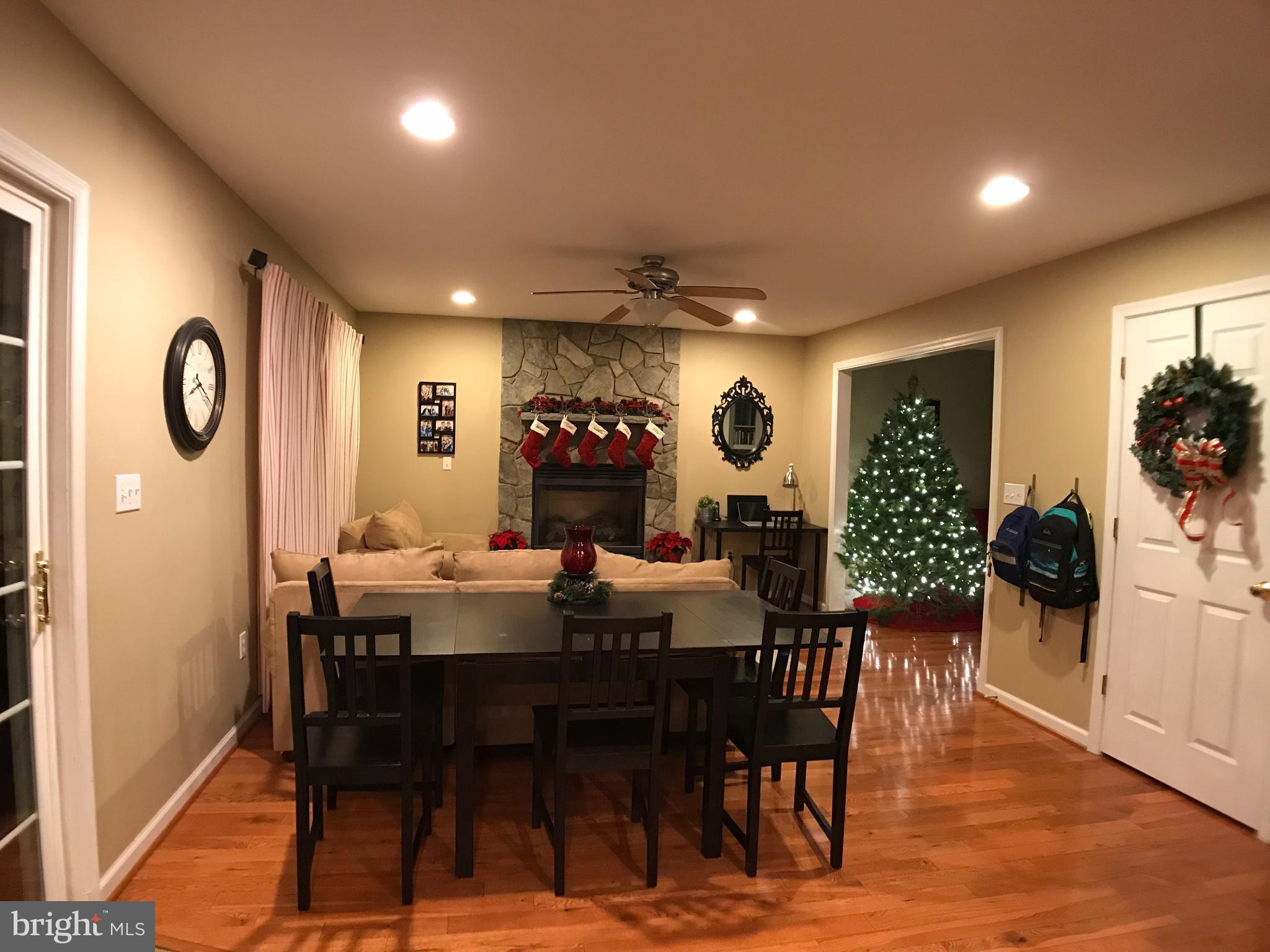 2313 Ruth Avenue Baltimore, MD 21219 - Photo 5 of 25 a view of a dining room with furniture and wooden floor