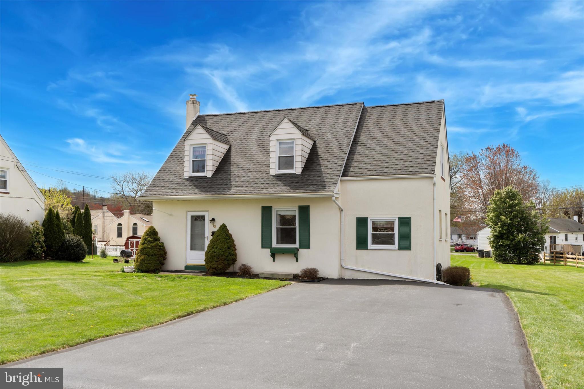 a front view of house with yard