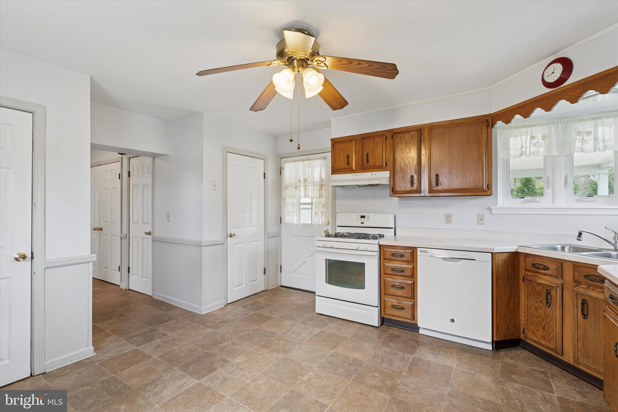 18 Lloyd Avenue Downingtown, PA 19335 - Photo 11 of 24 a kitchen with stainless steel appliances a stove a sink and a refrigerator