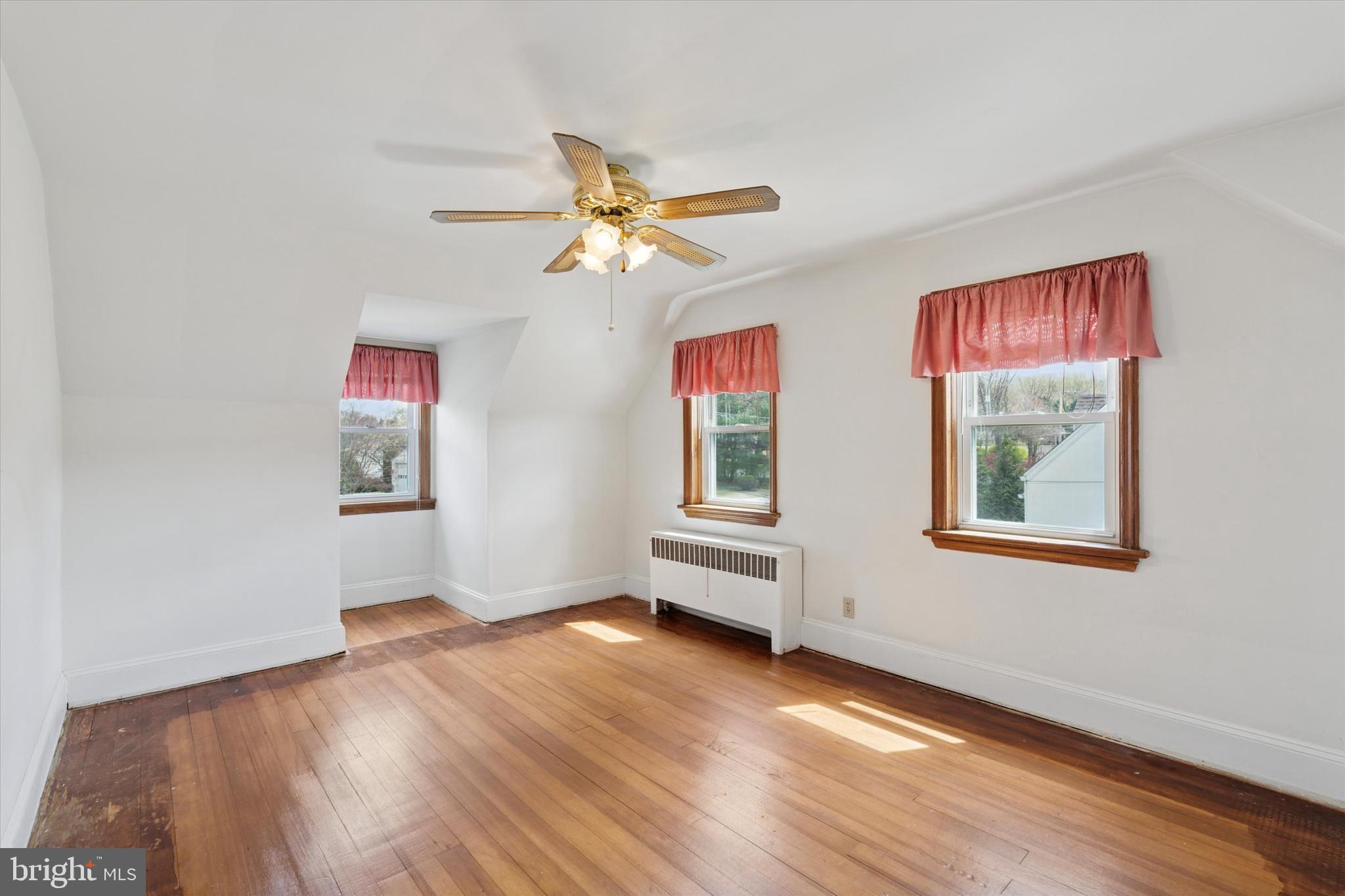 18 Lloyd Avenue Downingtown, PA 19335 - Photo 16 of 24 a view of an empty room with window and wooden floor