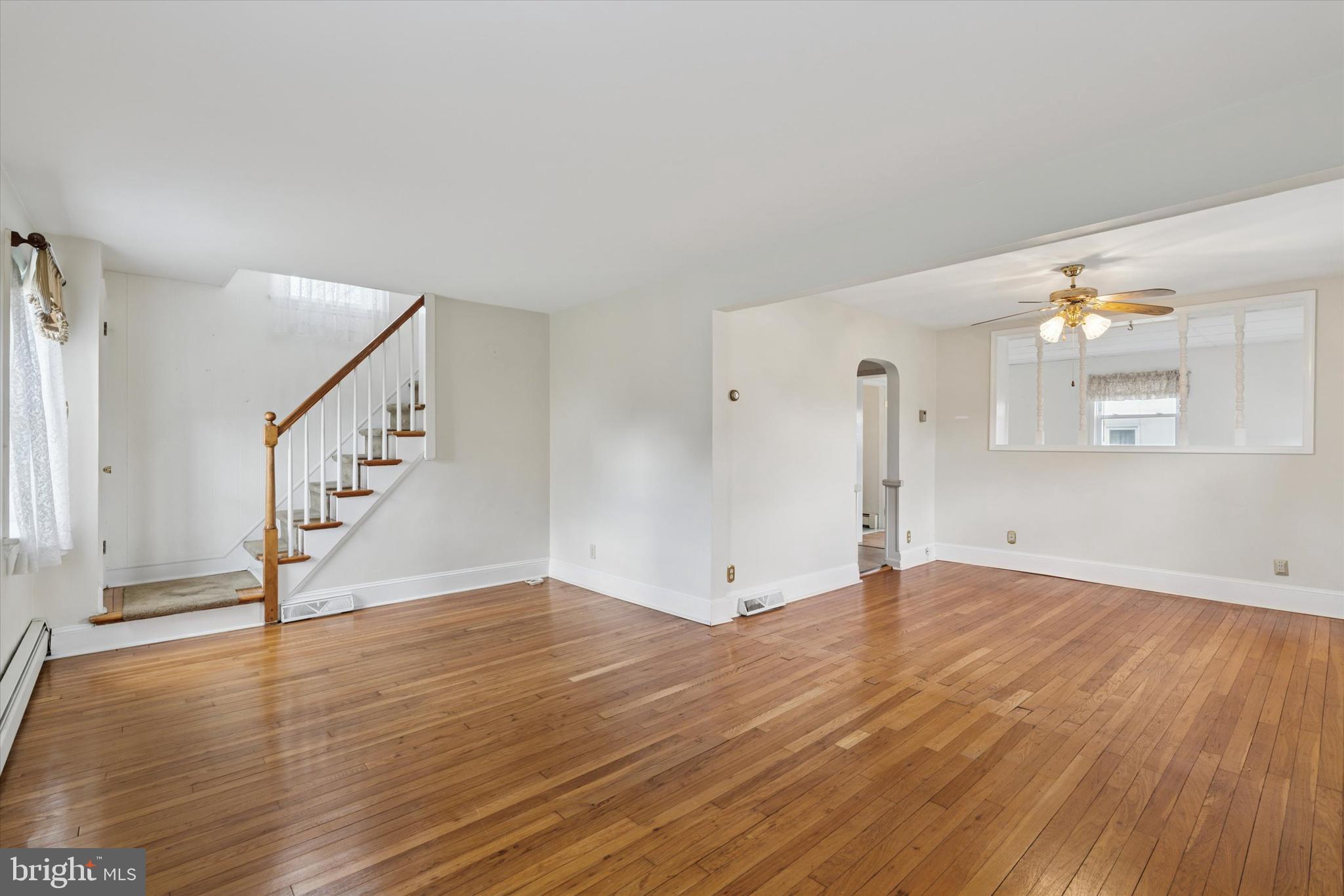 18 Lloyd Avenue Downingtown, PA 19335 - Photo 5 of 24 a view of an empty room with wooden floor and a window