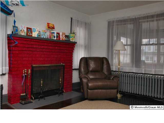 806 Rue Avenue Point Pleasant, NJ 08742 - Photo 2 of 3 a living room with furniture and a fireplace