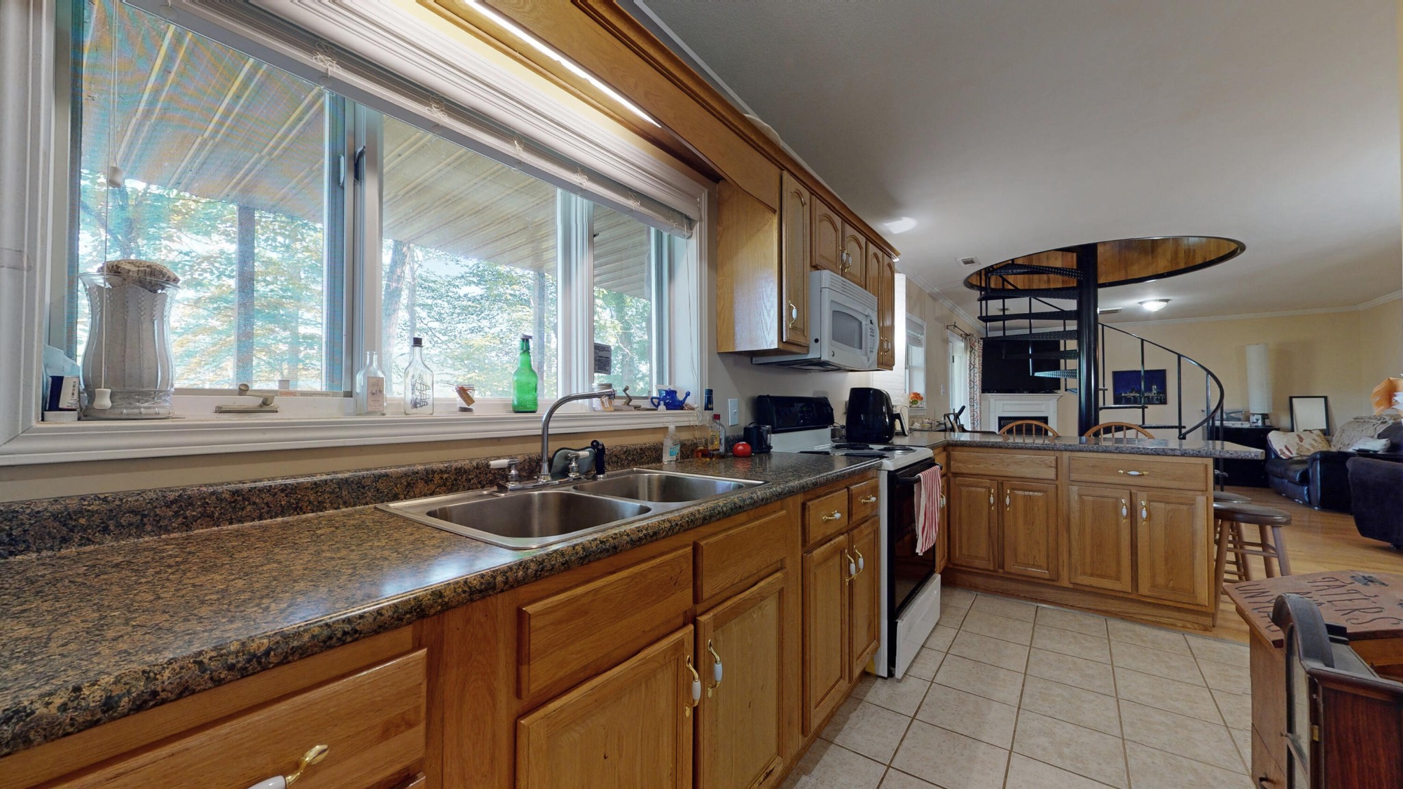 2031 Sulphur Springs Road Clinton, TN 37716 - Photo 23 of 31 a kitchen with kitchen island granite countertop a sink and counter space