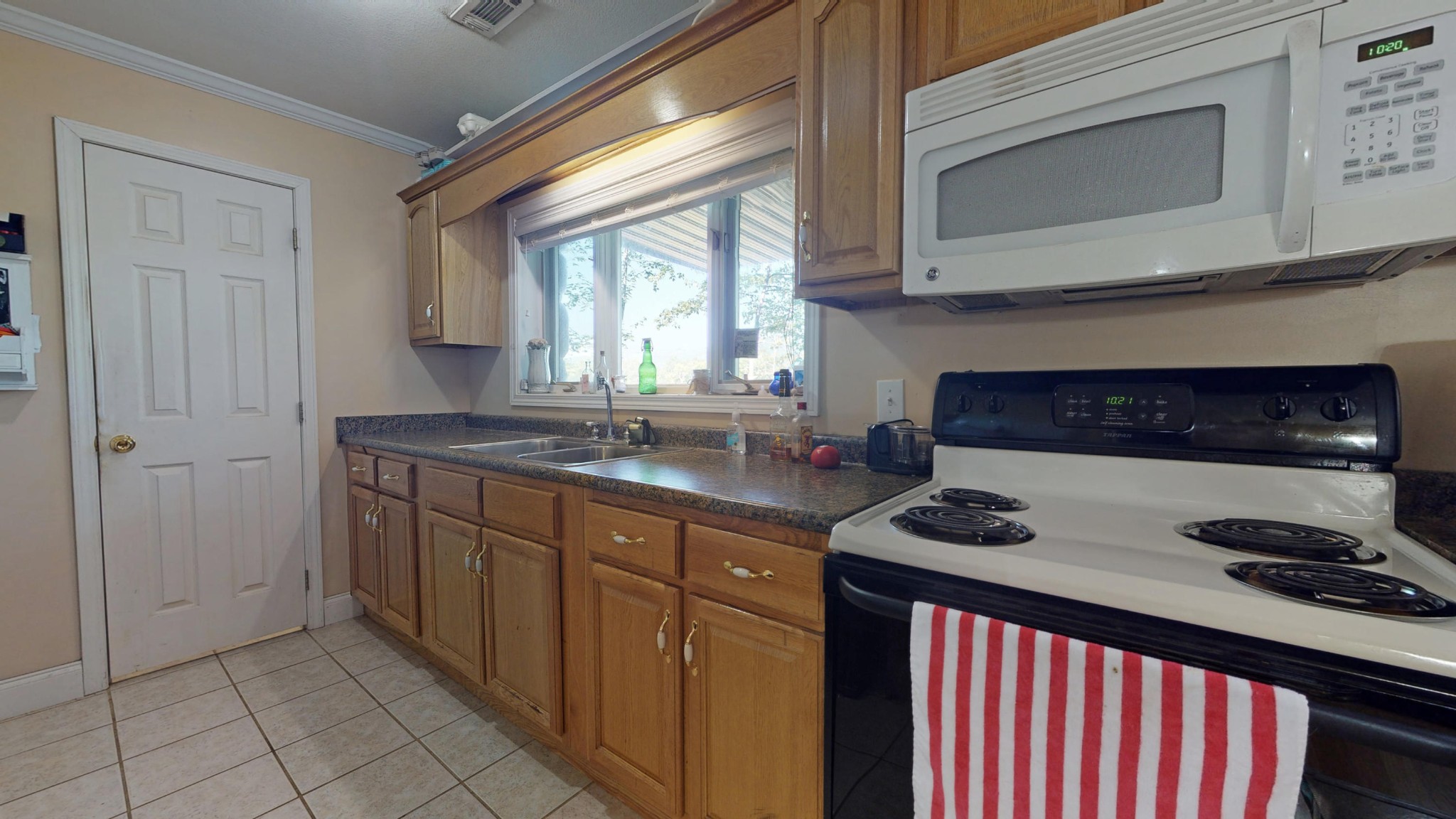 2031 Sulphur Springs Road Clinton, TN 37716 - Photo 24 of 31 a kitchen with stainless steel appliances granite countertop a sink stove and cabinets