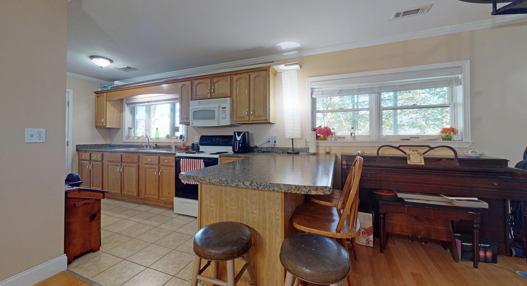 2031 Sulphur Springs Road Clinton, TN 37716 - Photo 25 of 31 a kitchen with a table chairs sink microwave and cabinets