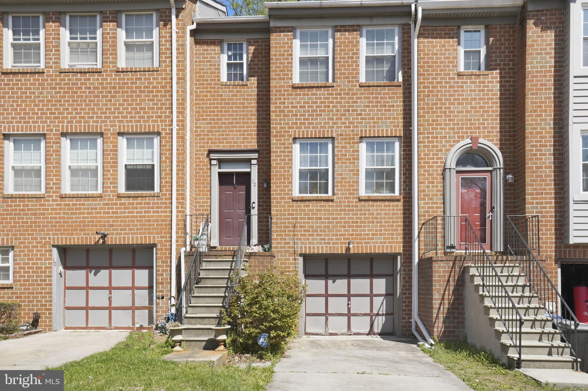 12 Sundown Court Baltimore, MD 21206 - Photo 1 of 29 a front view of a house with a garden