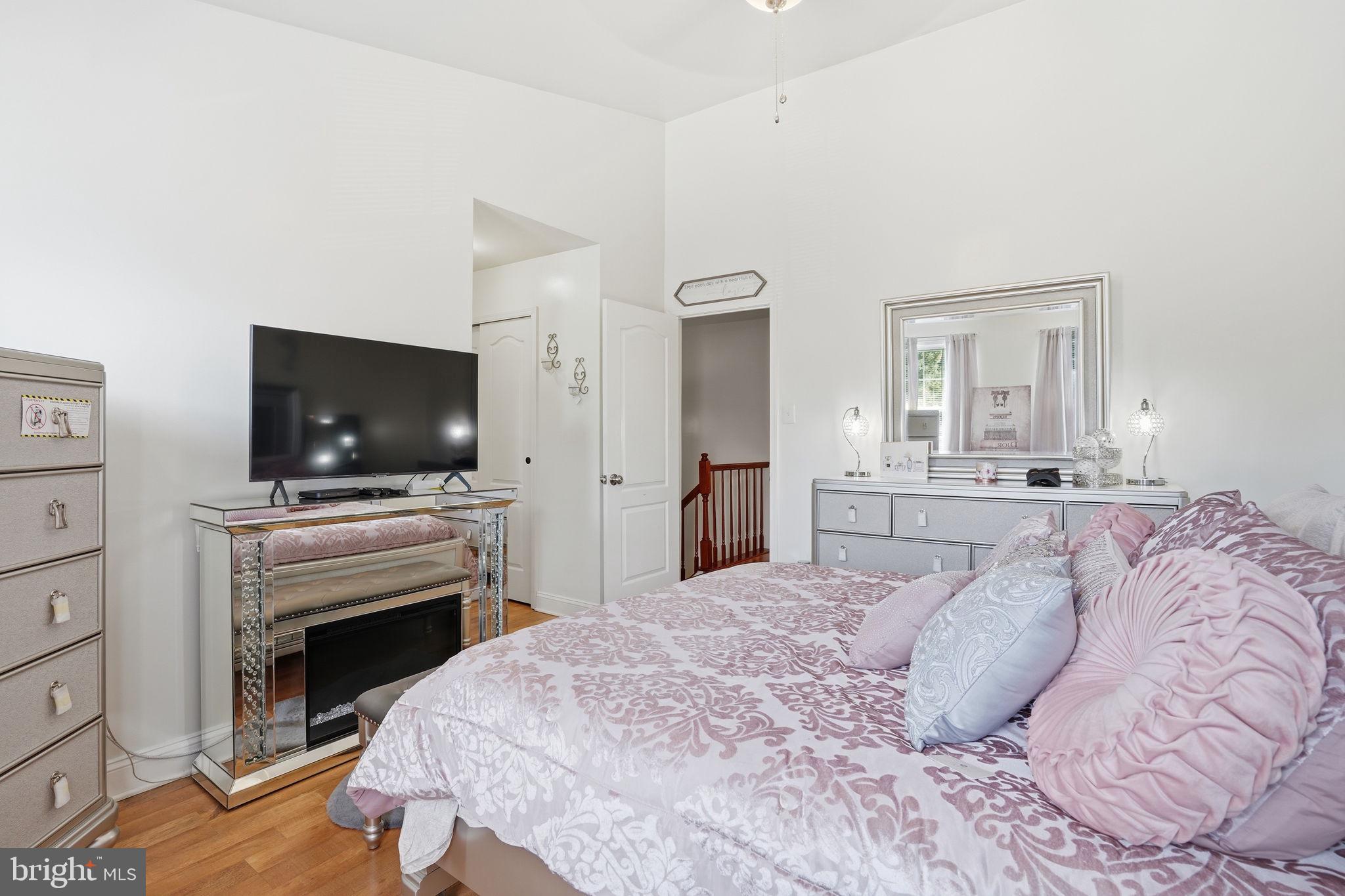 12 Sundown Court Baltimore, MD 21206 - Photo 13 of 29 a bedroom with a bed and a flat screen tv