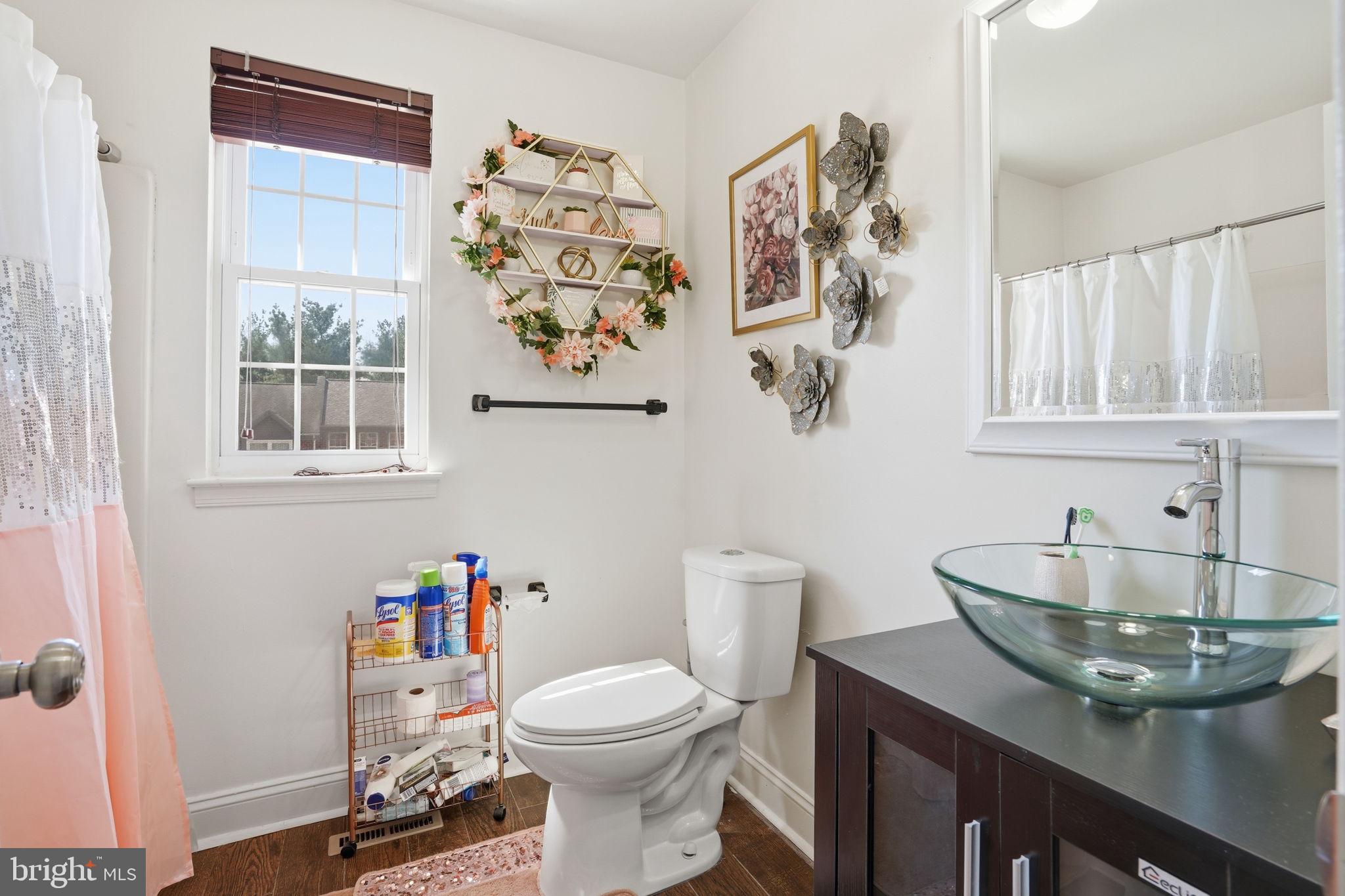 12 Sundown Court Baltimore, MD 21206 - Photo 14 of 29 a bathroom with a sink and a toilet