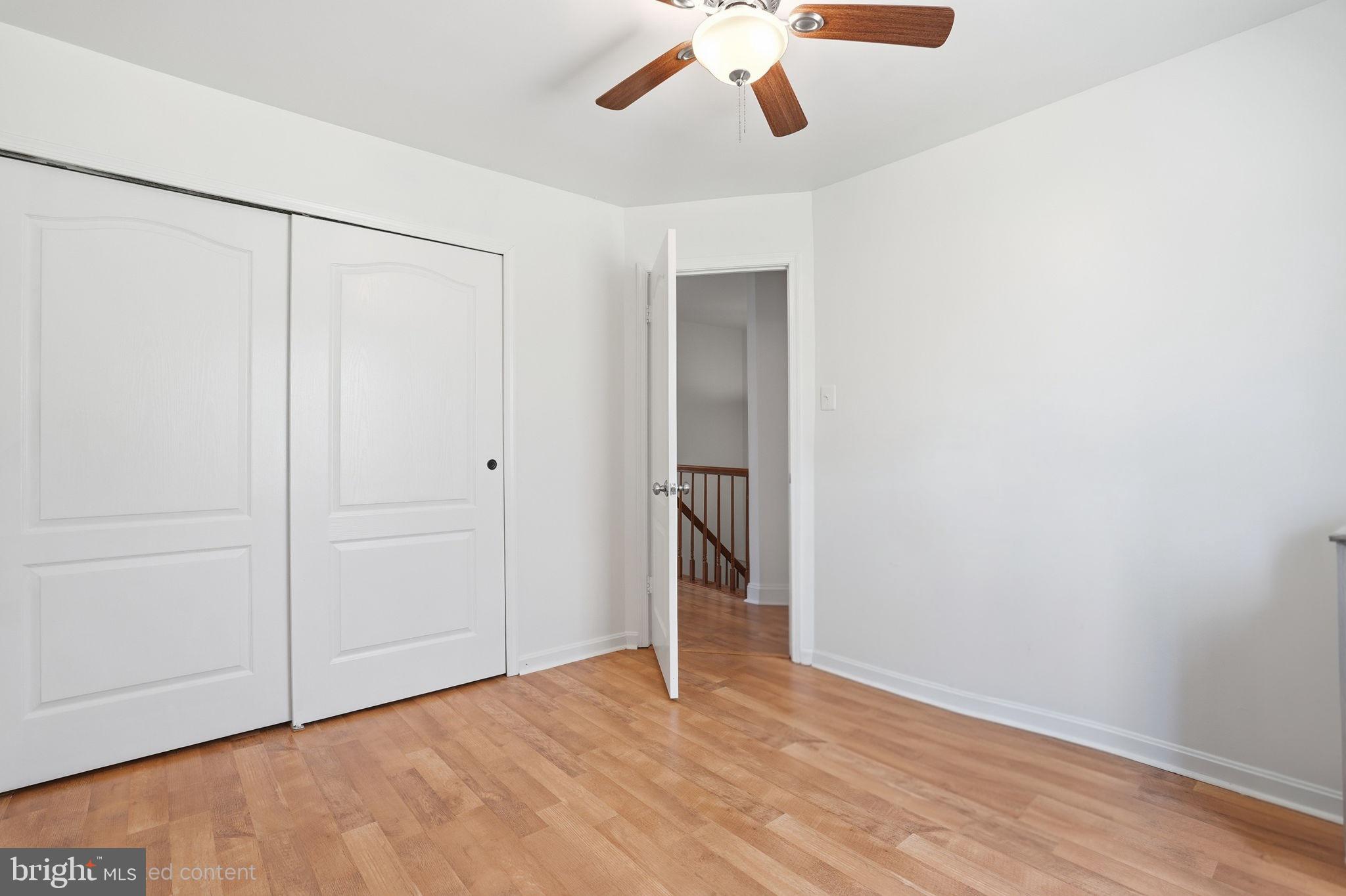 12 Sundown Court Baltimore, MD 21206 - Photo 16 of 29 a view of an empty room with a ceiling fan