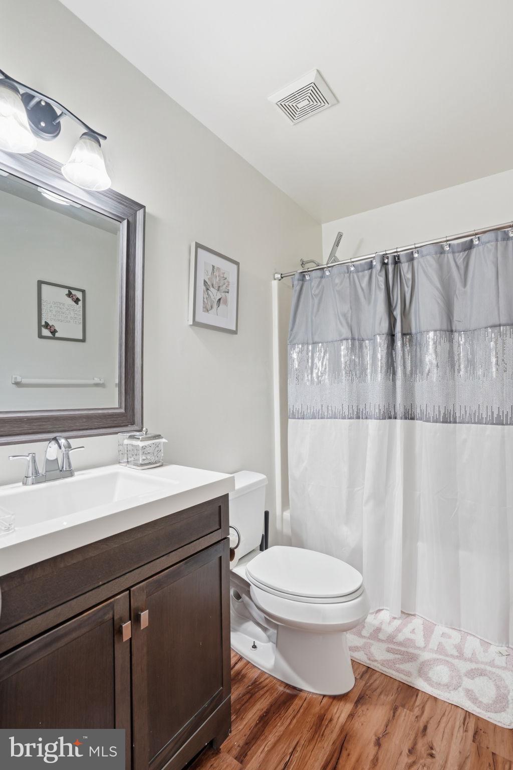 12 Sundown Court Baltimore, MD 21206 - Photo 19 of 29 a bathroom with a sink a toilet and shower