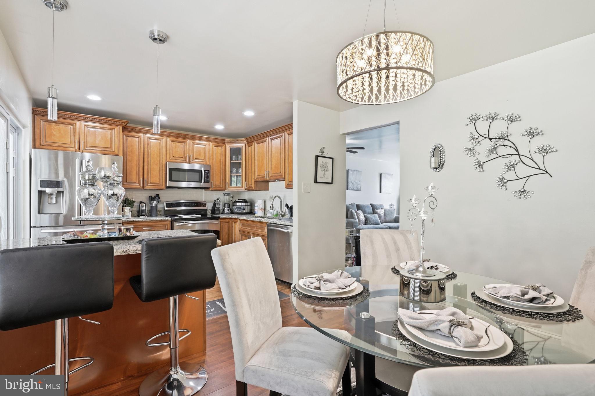 12 Sundown Court Baltimore, MD 21206 - Photo 9 of 29 a kitchen with a dining table and chairs