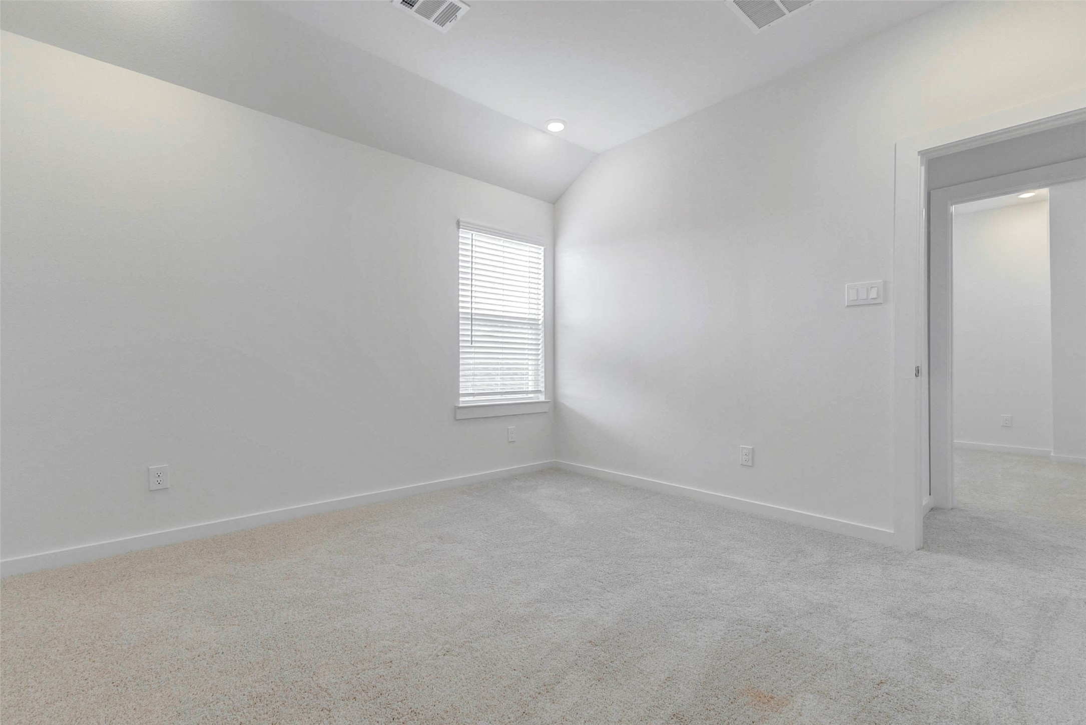 6471 Escondido Drive Rosharon, TX 77583 - Photo 28 of 33 Comfortable secondary bedroom with soft carpet, neutral finishes, recessed lighting, and a window with blinds. The room offers a practical layout with easy hallway access and enough open wall space for a bed, desk, dresser, or customized furniture arrangement.