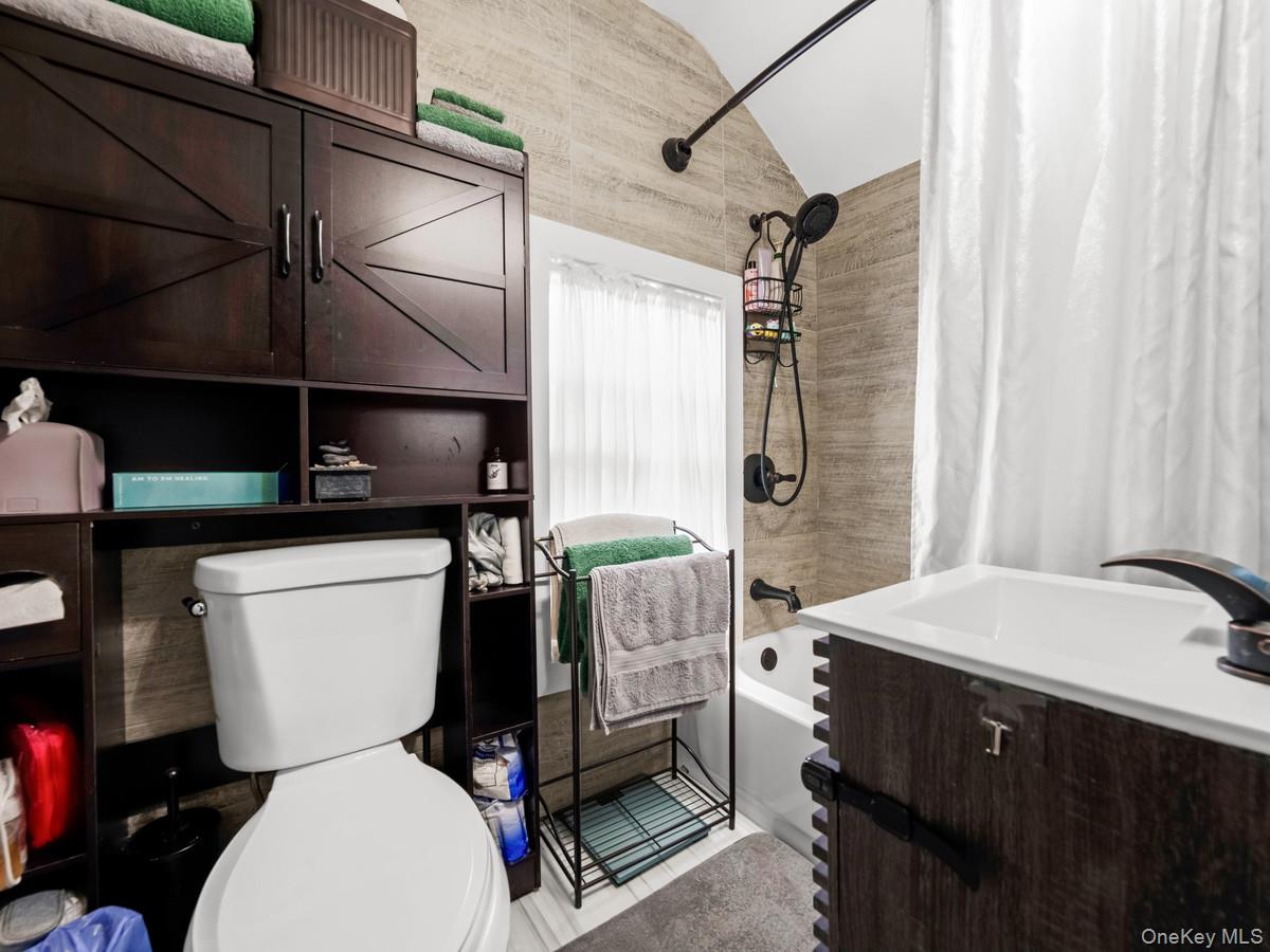 218-12 141st Road Queens, NY 11413 - Photo 7 of 14 a bathroom with a sink toilet and shower