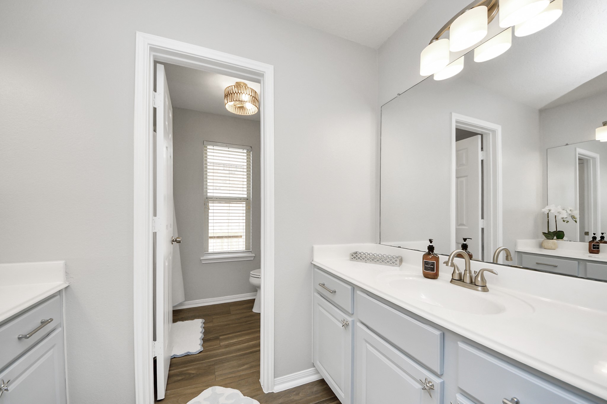 7823 Hazy Brook Lane Humble, TX 77396 - Photo 23 of 36 a bathroom with a sink a light fixture and a mirror