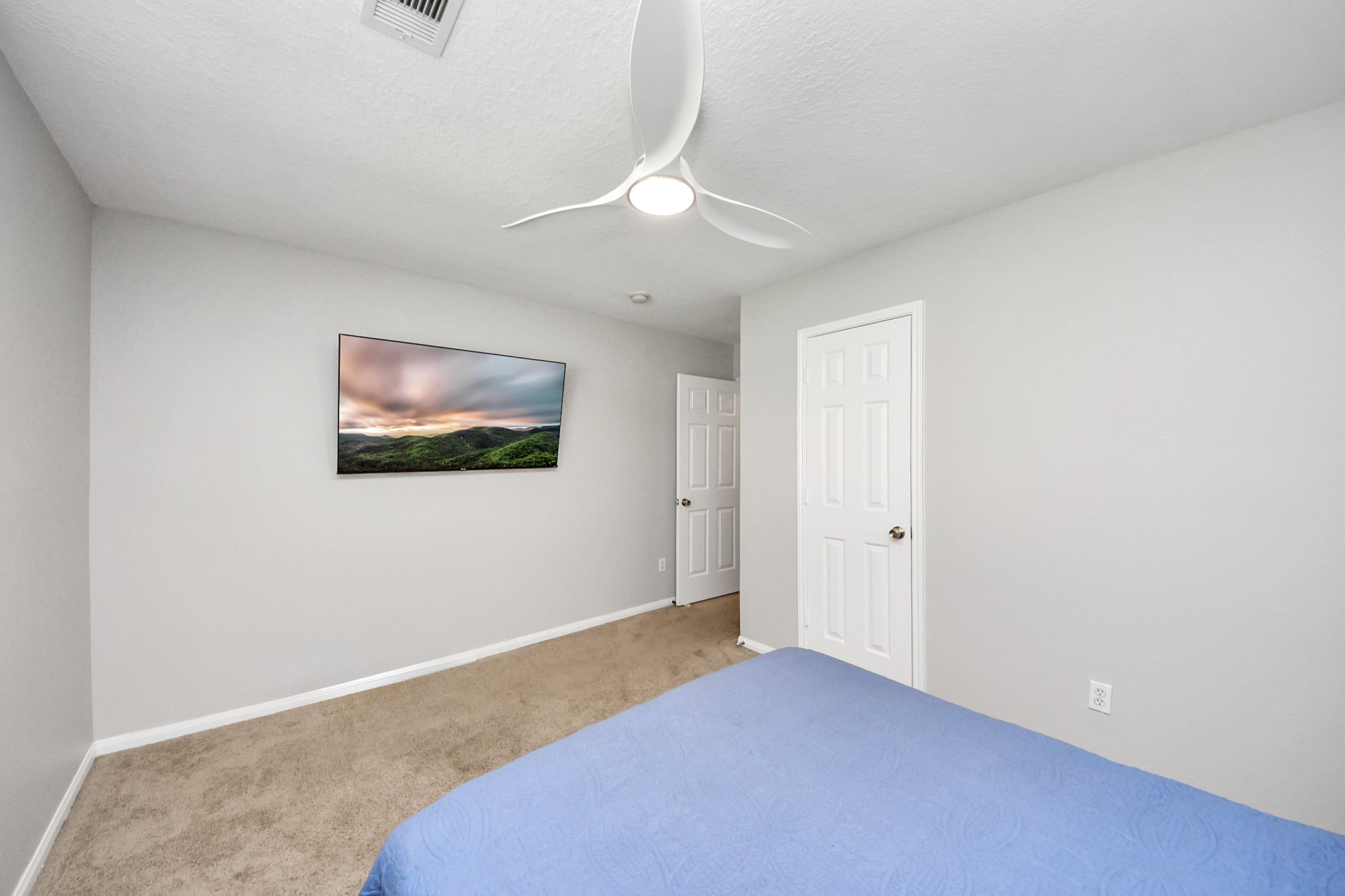 7823 Hazy Brook Lane Humble, TX 77396 - Photo 29 of 36 a bedroom with a bed and a ceiling fan