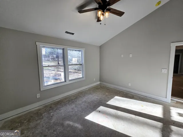 a view of an empty room with a window