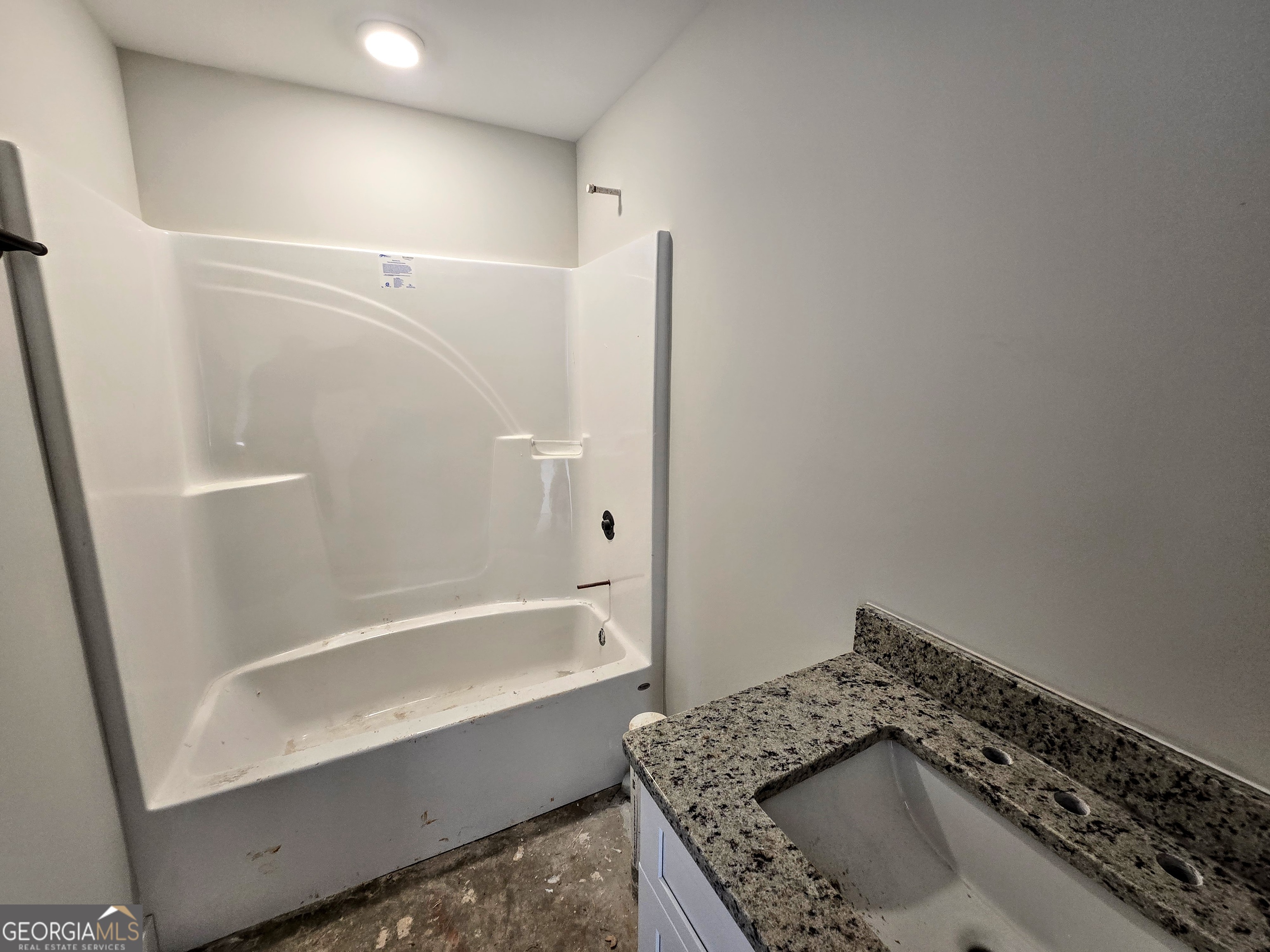 266 Center Point Road Bremen, GA 30110 - Photo 18 of 21 a bathroom with a granite countertop sink a toilet and bathtub