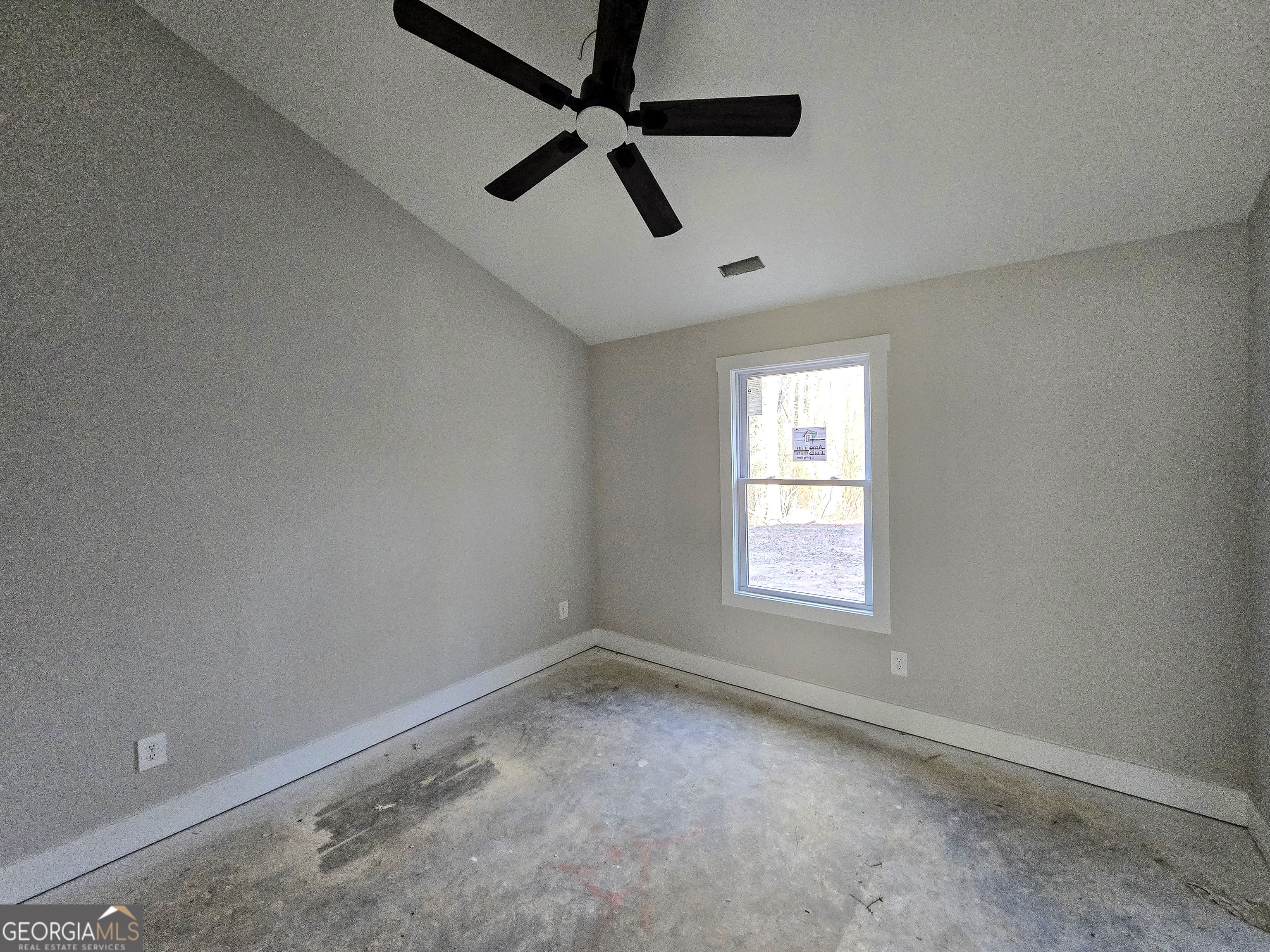 266 Center Point Road Bremen, GA 30110 - Photo 19 of 21 an empty room with a window and ceiling fan