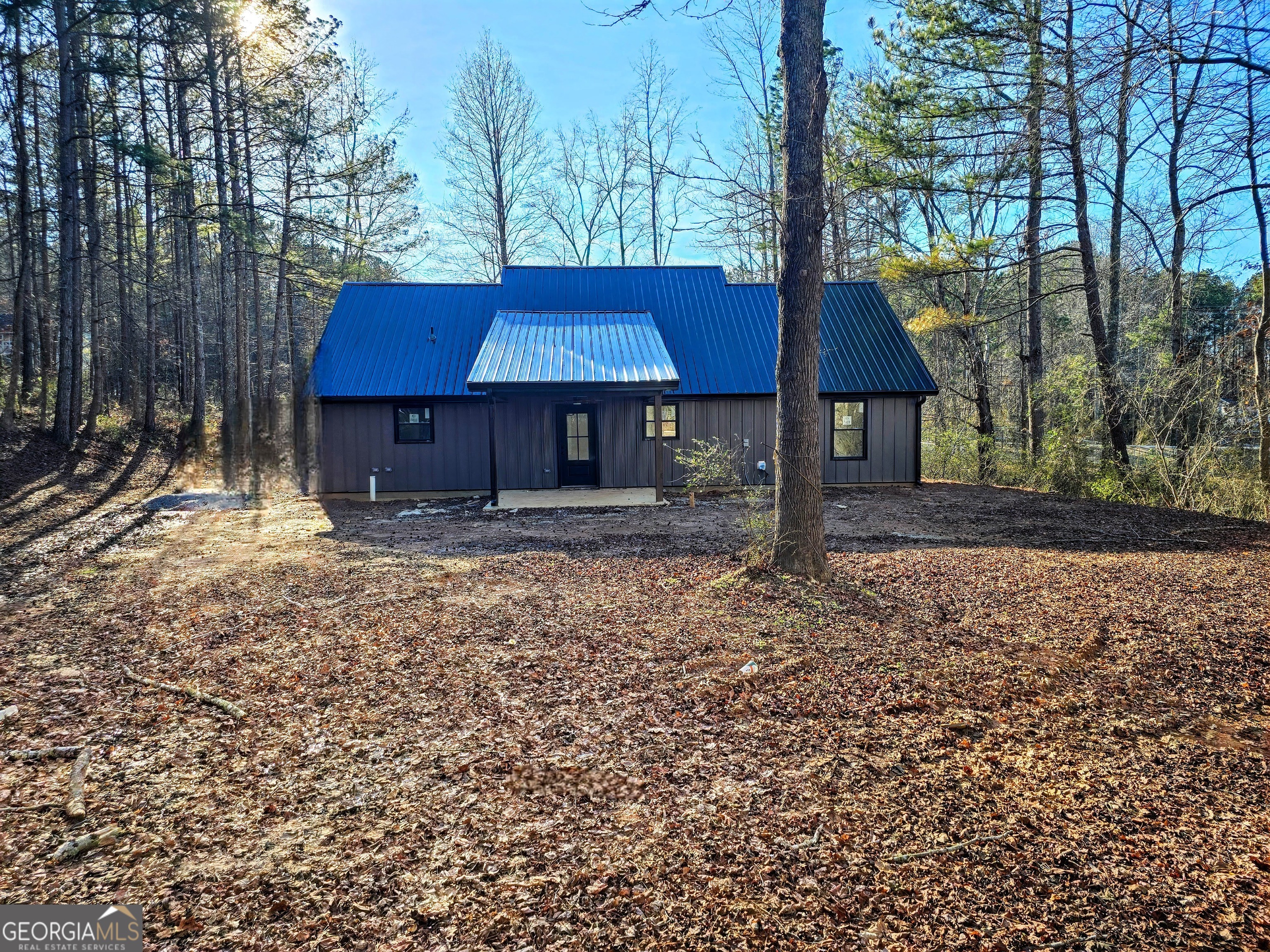 266 Center Point Road Bremen, GA 30110 - Photo 23 of 23 a couple of table and chairs under an umbrella