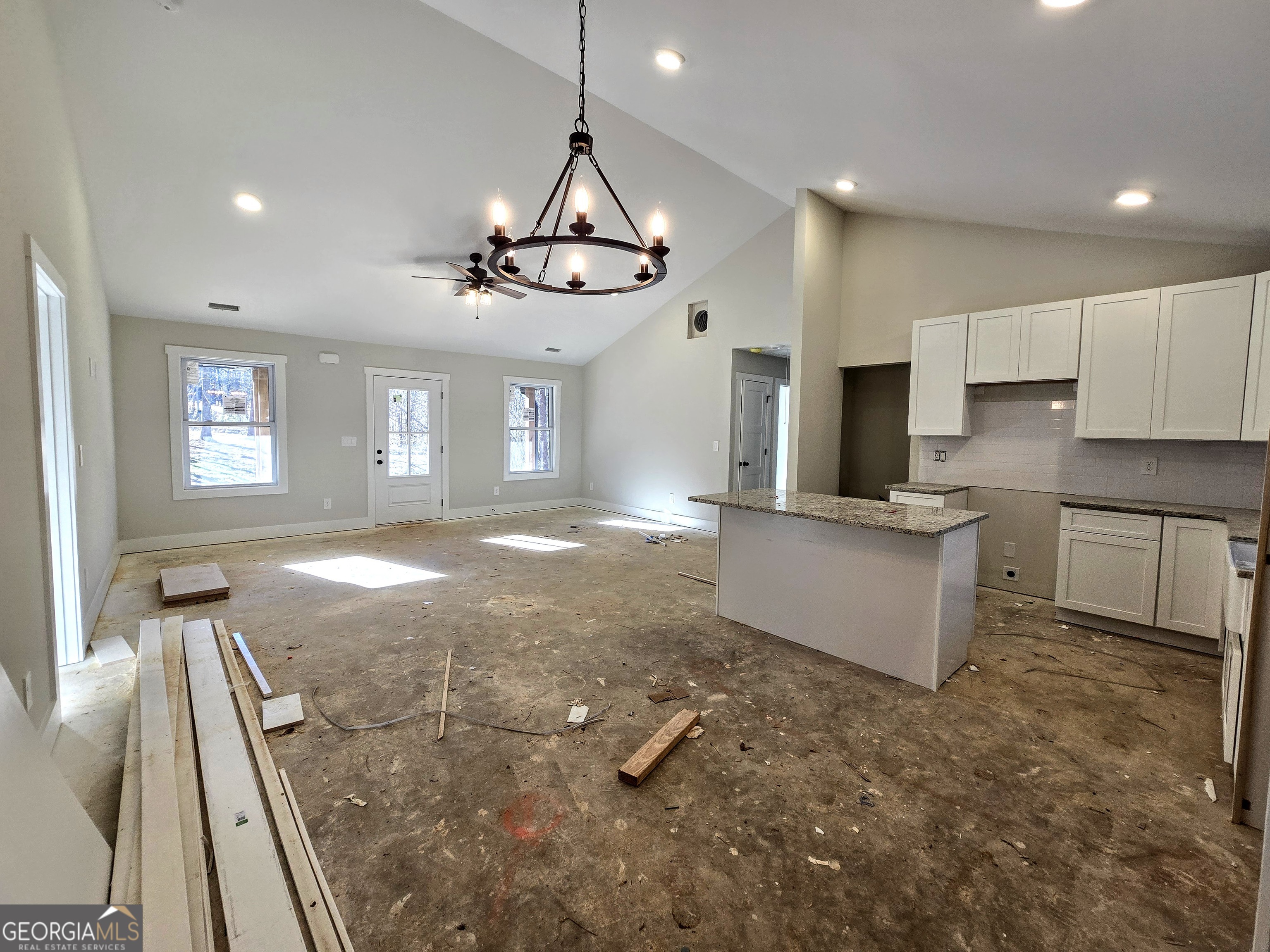 266 Center Point Road Bremen, GA 30110 - Photo 8 of 21 a kitchen with granite countertop a stove a sink a refrigerator and a granite counter tops