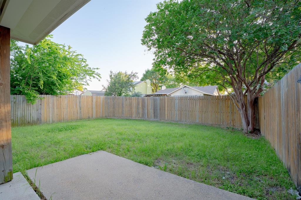 3721 Smartt Street Rowlett, TX 75088 - Photo 22 of 27 a view of a backyard with a tree