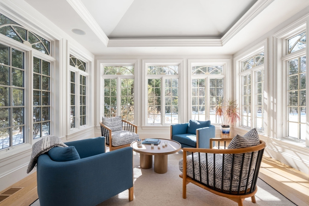 24 Colonial Way Weston, MA 02493 - Photo 12 of 32 a living room with furniture and a large window