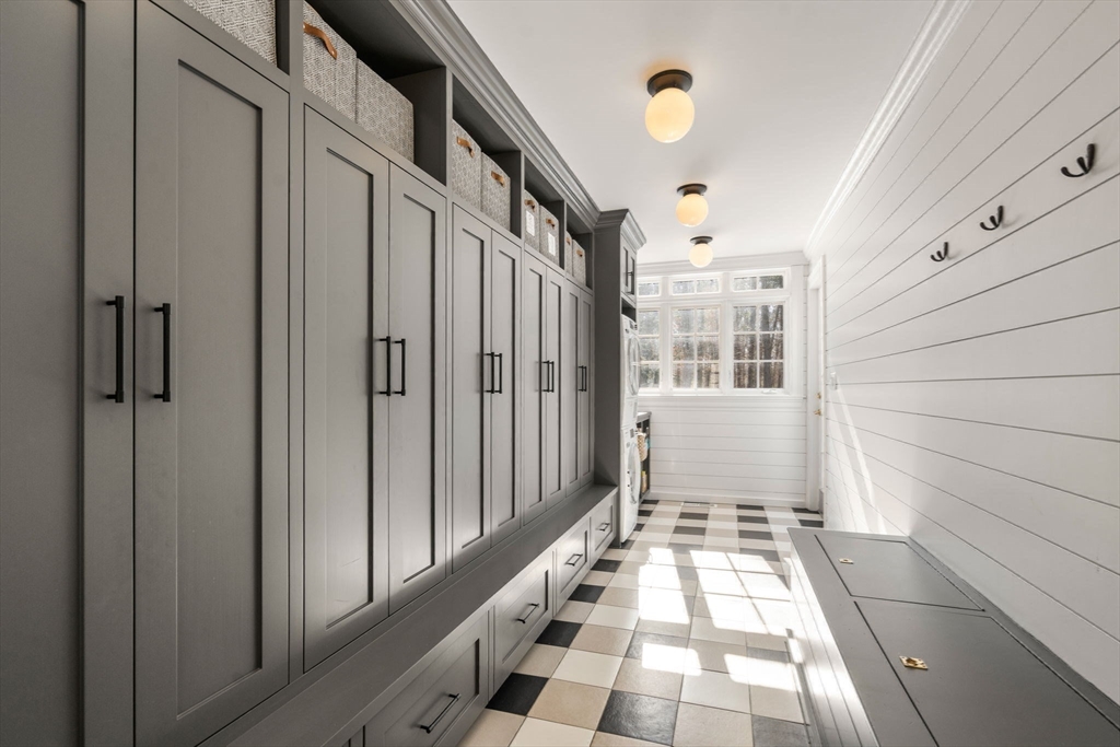 24 Colonial Way Weston, MA 02493 - Photo 13 of 32 a view of a hallway with wooden floor and staircase