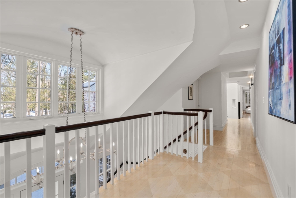 24 Colonial Way Weston, MA 02493 - Photo 15 of 32 a view of a hallway with windows