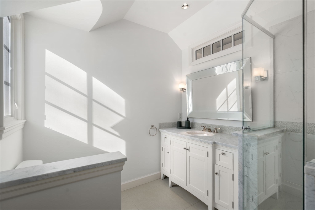 24 Colonial Way Weston, MA 02493 - Photo 20 of 32 a bathroom with a sink and a mirror