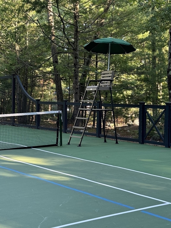 24 Colonial Way Weston, MA 02493 - Photo 28 of 32 a view of a tennis ground with large trees
