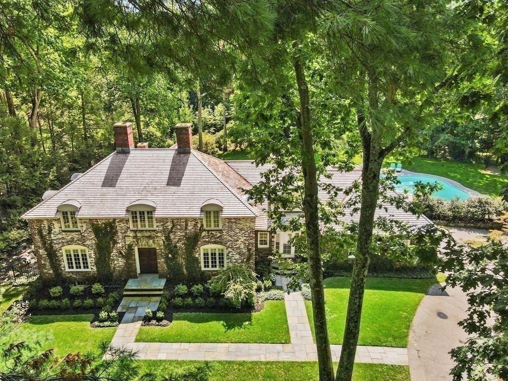 24 Colonial Way Weston, MA 02493 - Photo 30 of 32 a view of a white house with a big yard and potted plants and large trees
