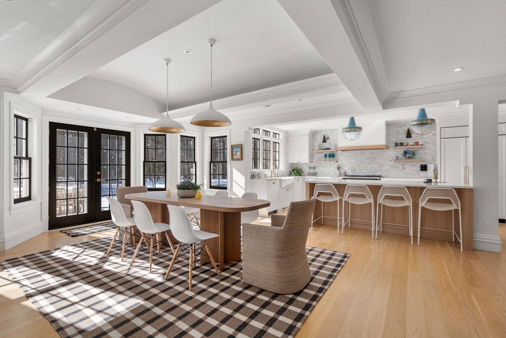 24 Colonial Way Weston, MA 02493 - Photo 4 of 32 a dining room with furniture a chandelier and wooden floor