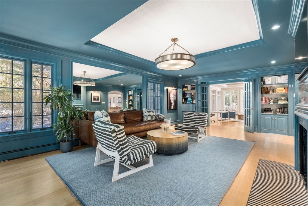 24 Colonial Way Weston, MA 02493 - Photo 6 of 32 a living room with furniture and a chandelier