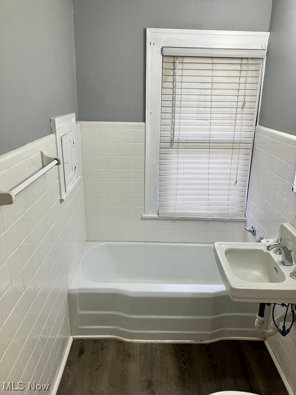 2108 Volney Road Youngstown, OH 44511 - Photo 13 of 27 2nd Floor Bathroom featuring sink, tile walls, and hardwood / wood-style flooring