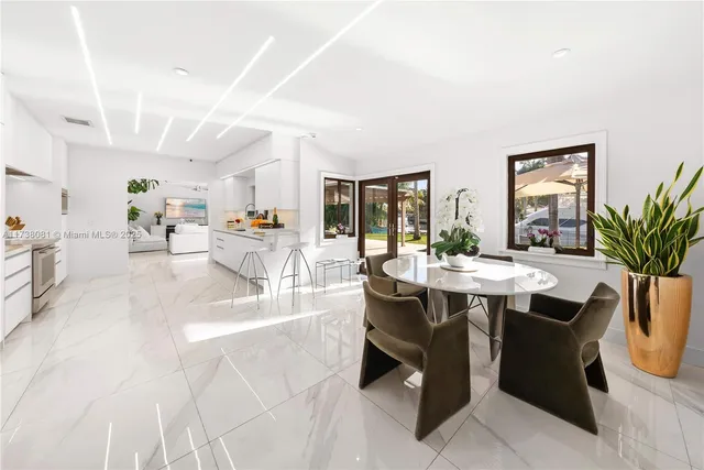 a view of a dining room with furniture and window