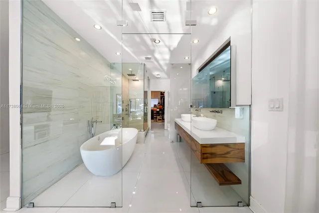 a spacious bathroom with a tub and mirror