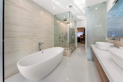 a bathroom with a bathtub and a sink