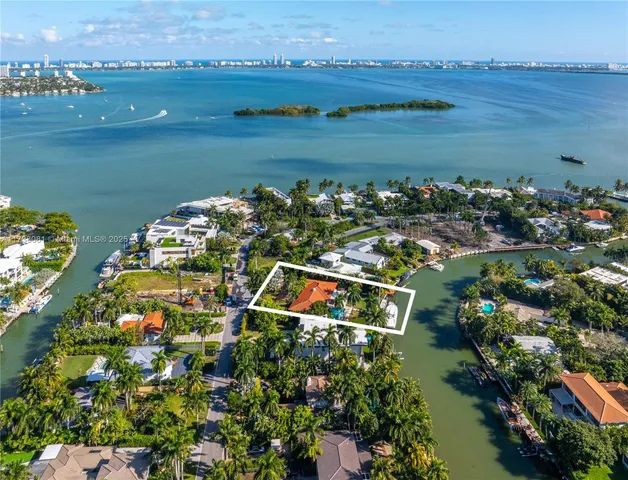 an aerial view of a house with a lake view