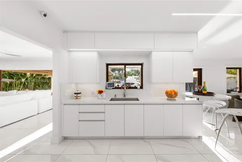 a kitchen with a sink and cabinets