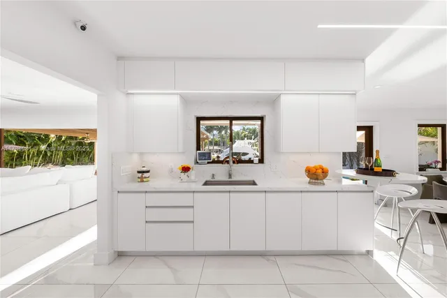 a kitchen with a sink and cabinets