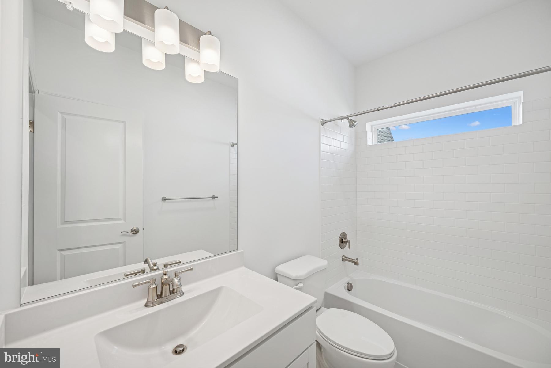 2730 Tuscarora Road Adamstown, MD 21710 - Photo 16 of 37 a bathroom with a sink toilet and shower