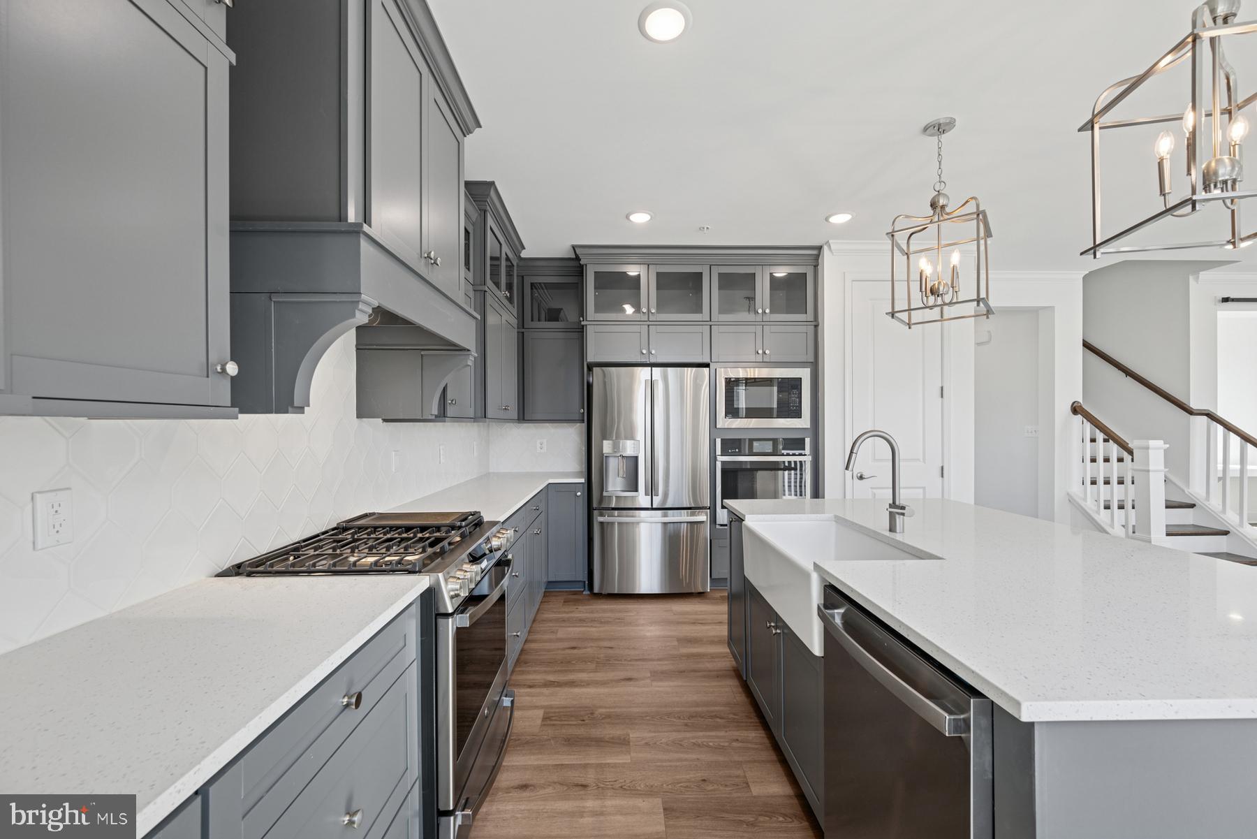 2730 Tuscarora Road Adamstown, MD 21710 - Photo 26 of 37 a kitchen with stainless steel appliances a sink stove and refrigerator