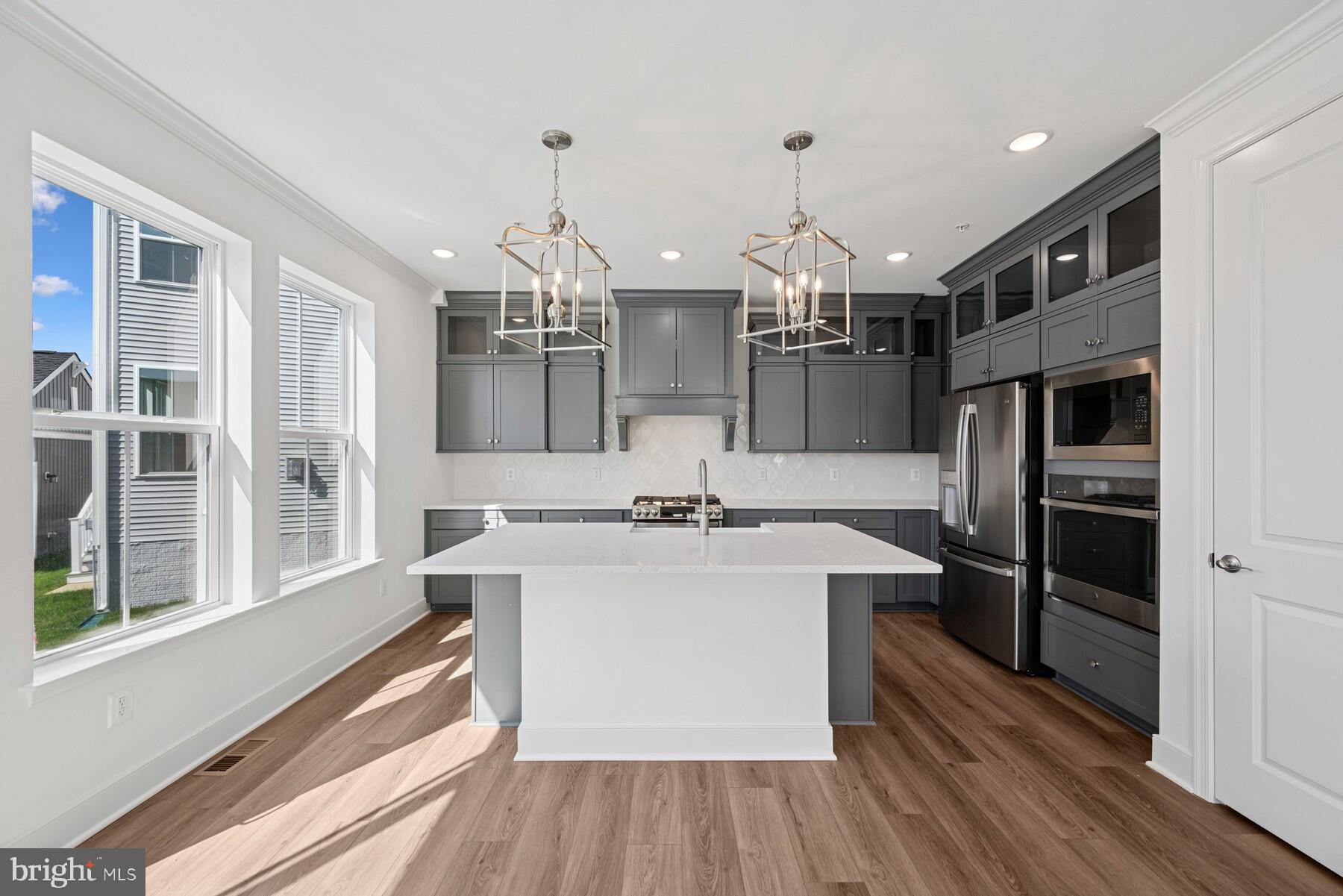 2730 Tuscarora Road Adamstown, MD 21710 - Photo 28 of 37 a kitchen with kitchen island a counter top space stainless steel appliances and a window