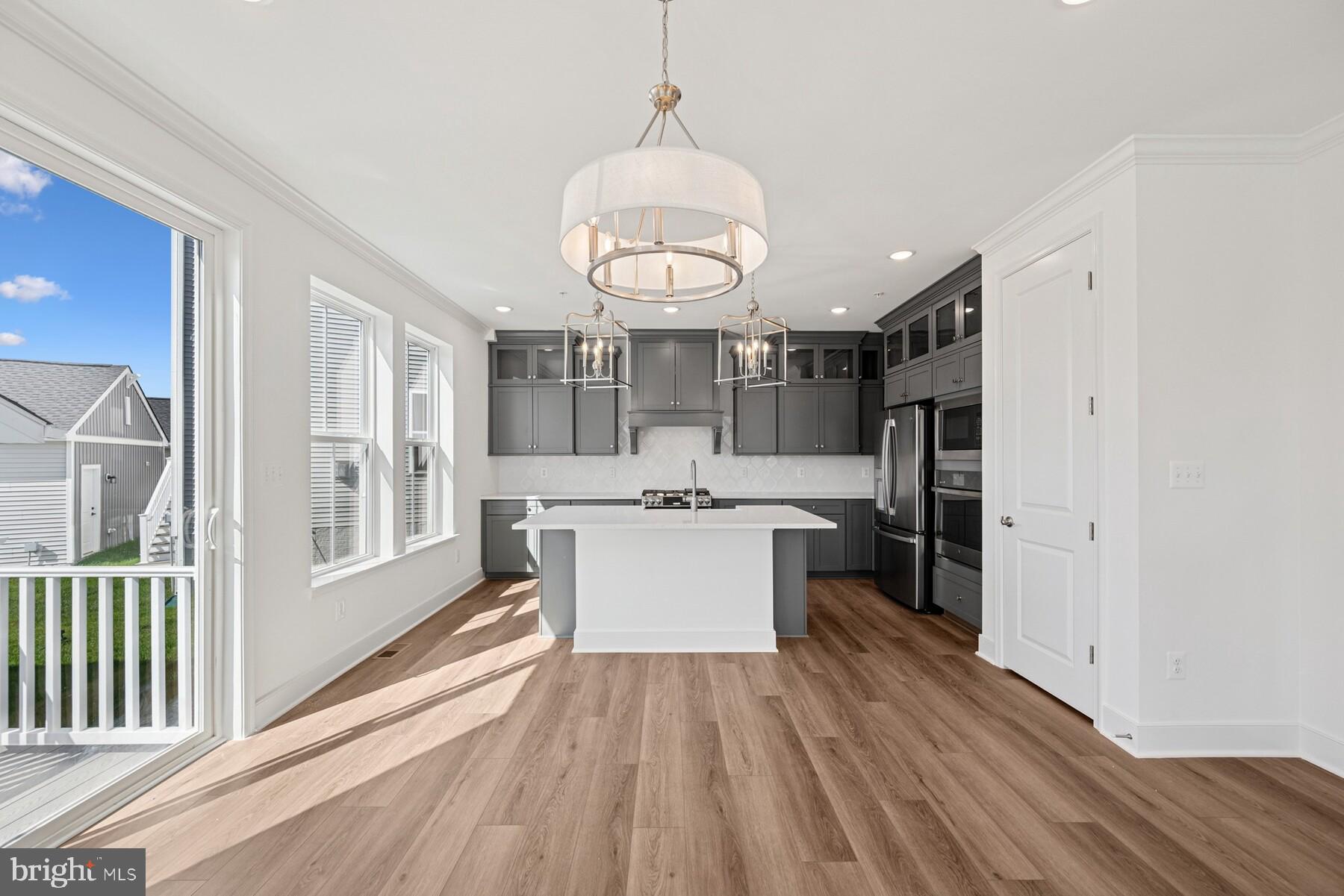 2730 Tuscarora Road Adamstown, MD 21710 - Photo 29 of 37 a view of a living room and kitchen with wooden floor