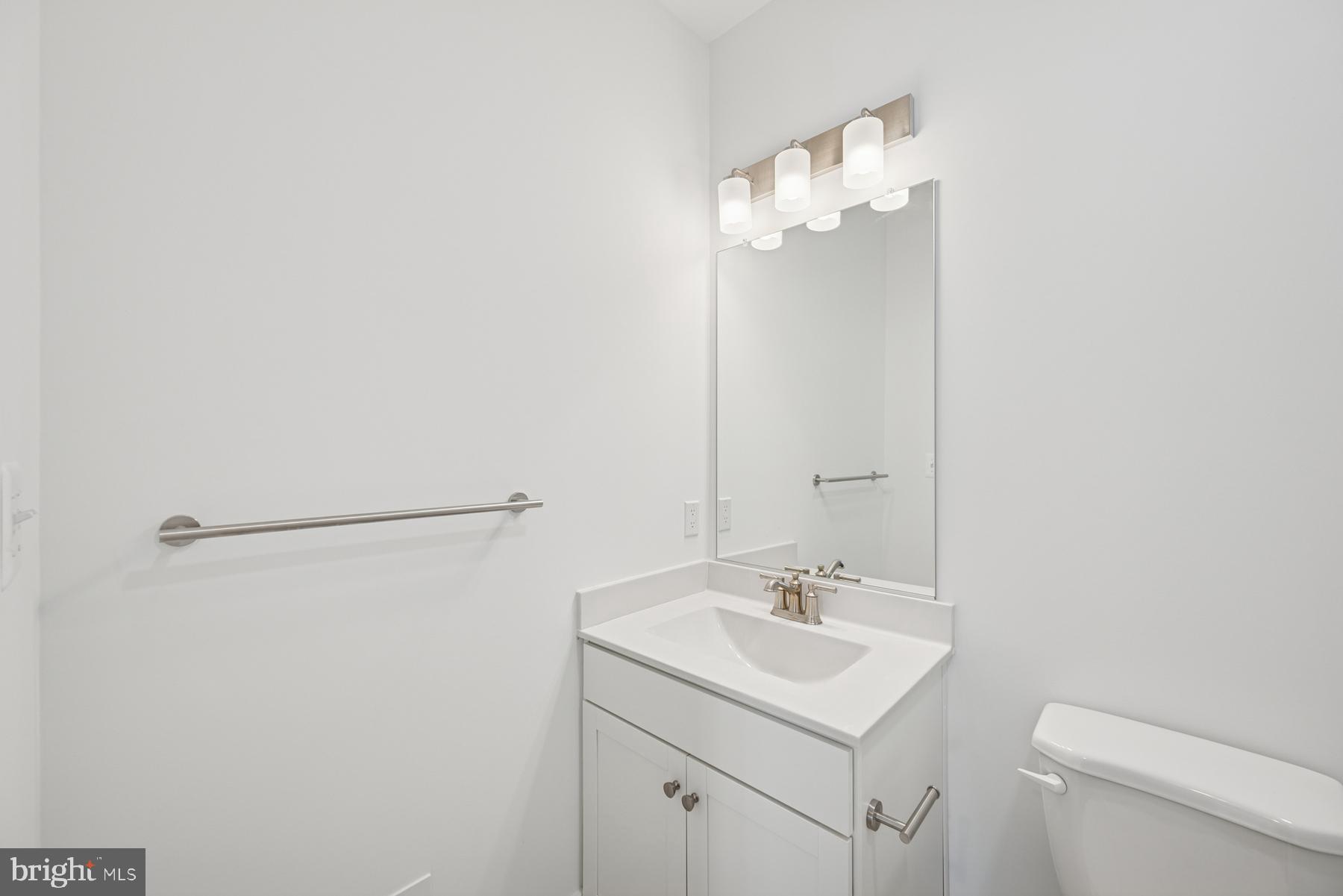 2730 Tuscarora Road Adamstown, MD 21710 - Photo 30 of 37 a bathroom with a sink vanity and a mirror